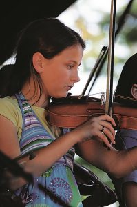 Fiddlers on stage. Photo: Scott Butner