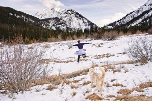 With outflung arms, trail runner Justin Sullivan on Enterprise seems to embody the wild joy of snowmelt season on a slushy spring run under Mount Sacajawea in Hurricane Creek Canyon. Snow patches can last into July on the Wallowa trails, and this year, the road to the Hurricane Creek Trailhead is still blocked by the avalanche that typically rumbles across the road in the winter. The blockage, about a mile from the trailhead, could remain well into June.