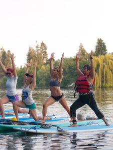 Paddleboard yogis line up in a lunge. Photo: Shallan Knowles