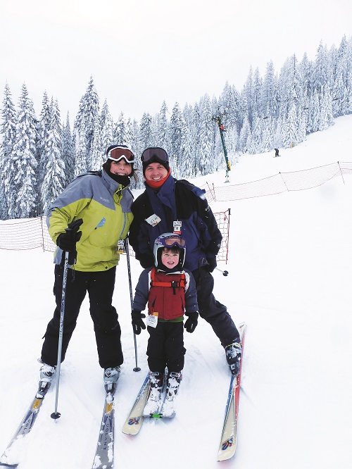 Amy helping her son to ski when he was 2 years old, at Mt. Spokane. Photo: Judd McCaffree