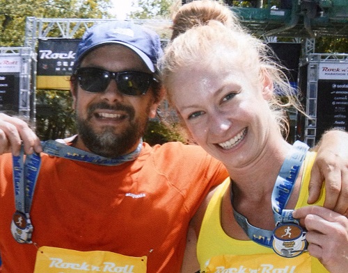 Travis and Liz celebrate at the finish line after 26.2 miles.