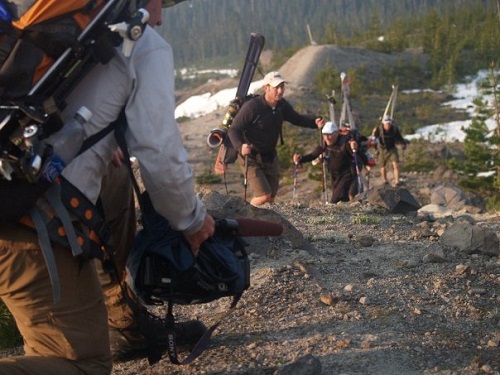 Hikers use trekking poles to navigate the rugged, rocky ascent on Mount St. Helens.