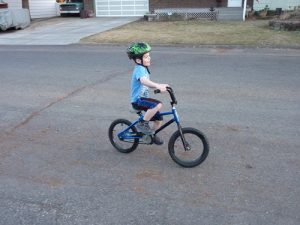 Child riding a bike.