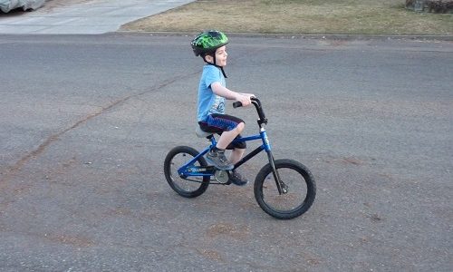 Child riding a bike.