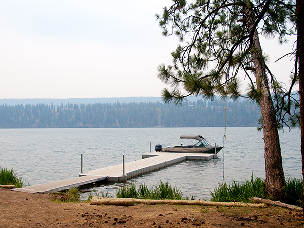 Photo of boat at the end of the dock on Lake Spokane.