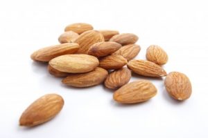 5450335-several-almonds-on-white-background