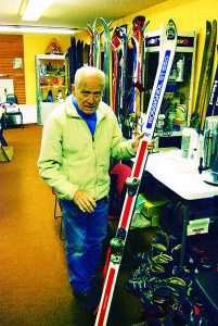 Loulou Kneubuhler showing off one of his collectable skis with an experimental release binding. Photo: Chic Burge