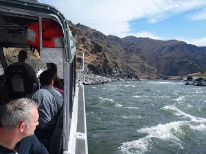 Passengers enjoying an Idaho River jet boat tour.