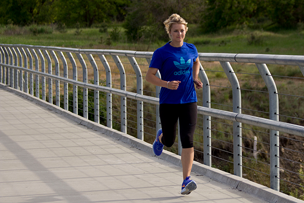 Photo of runner on bridge.