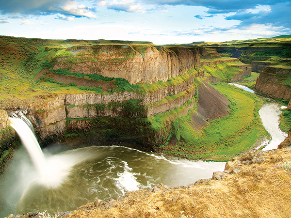 Majestically tall Palouse Falls in the river canyon.