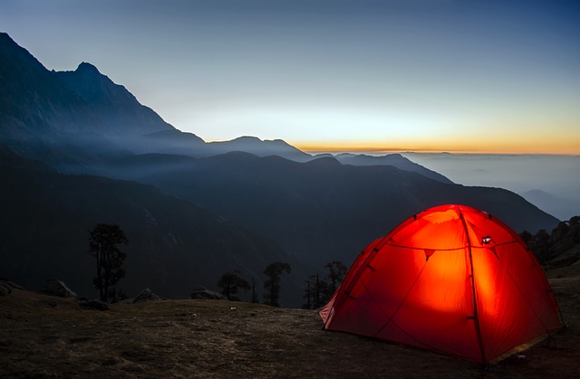 Tent in mountainous landscape.