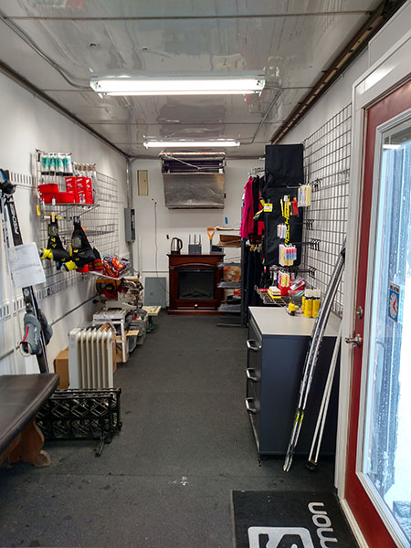 Inside glance at the rental trailer, including a warming fireplace and some supplies for purchase.