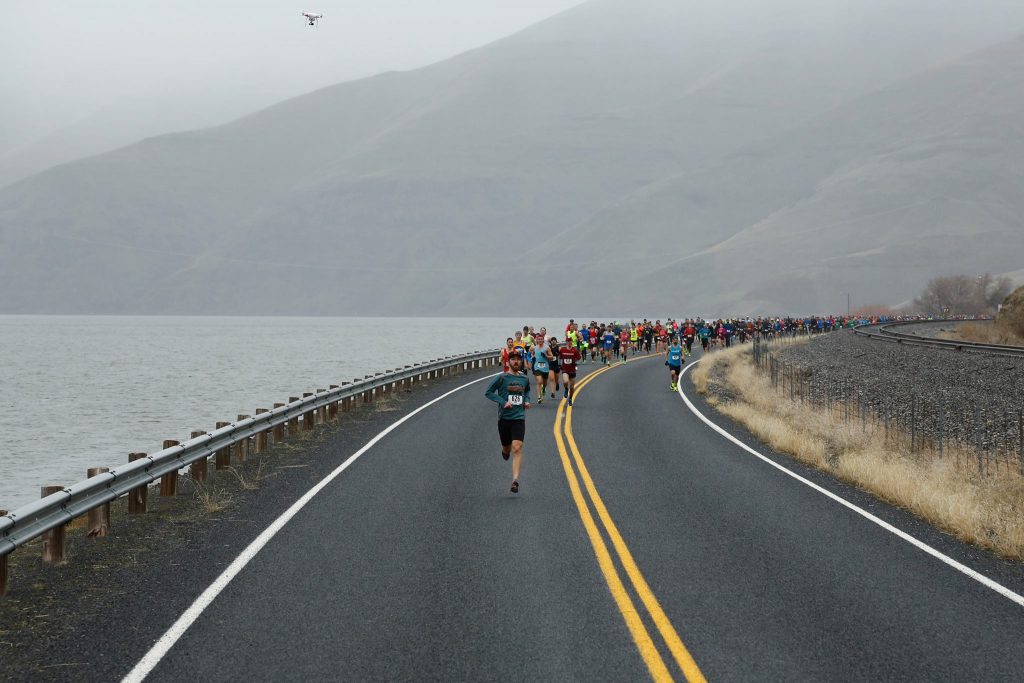 Runners settle into their pace as they round the first bend during the Snake River Canyon Half Marathon (Photo: Cecil Williams)