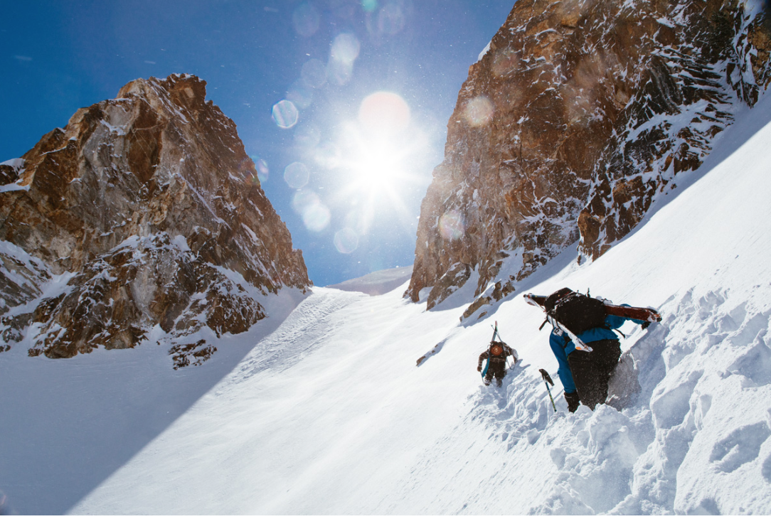 Photo from Winter Wildlands Alliance re: Backcountry Film Festival. Mountaineer skiers approach a steep chute. 