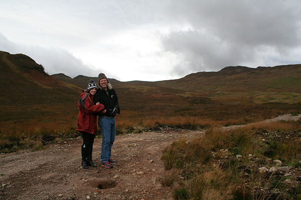 Photo of Anya & Jonathan on a hiking trail in Scotland.