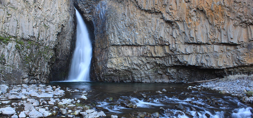 Photo of Hawk Creek waterfall by Holly Weiler.