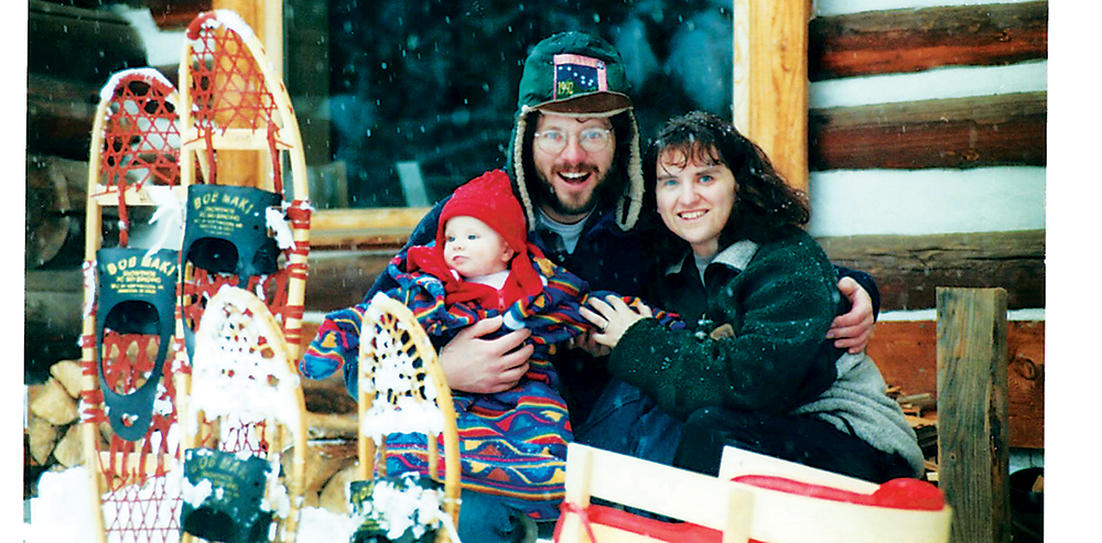 photo of Howko family in front of cabin.