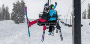 Photo of skiers on chairlift courtesy of Rachel Harding.