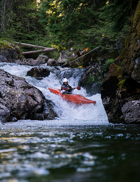 Photo of whitewater kayaker navigating rapids.