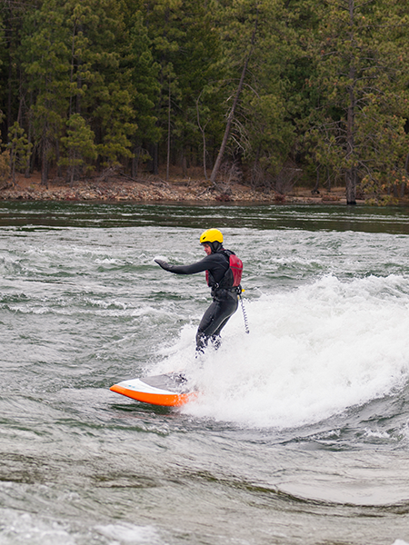 Photo of paddleboarder surfing Corbin's Wave.