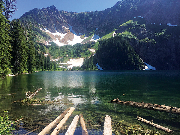 photo of Cliff Lake from shoreline with mountains in the background.