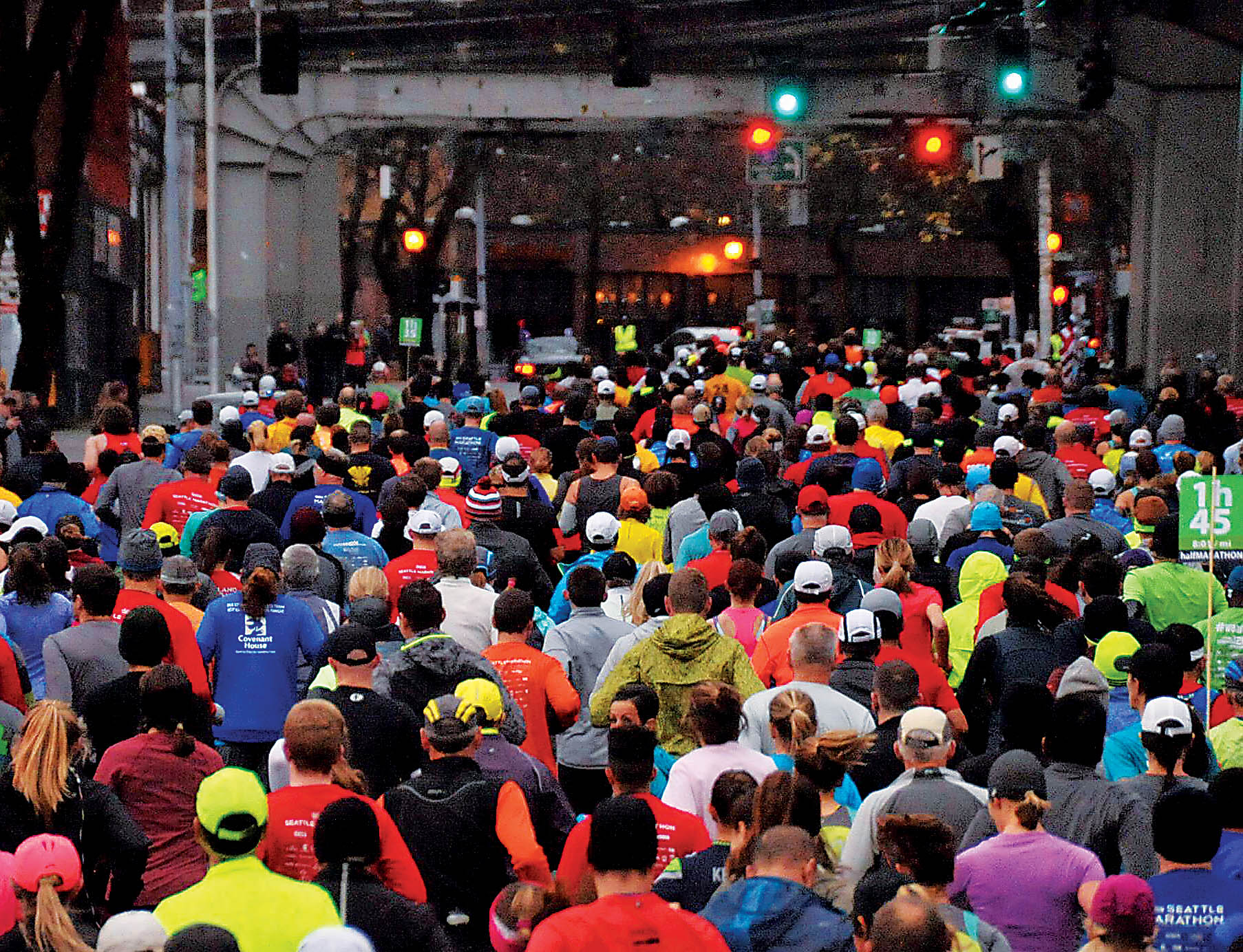 Photo of racers running under an overpass in Seattle.