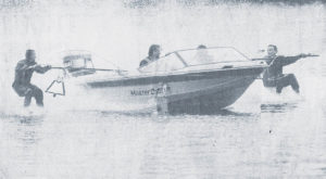 Photo of two waterskiers and boat.