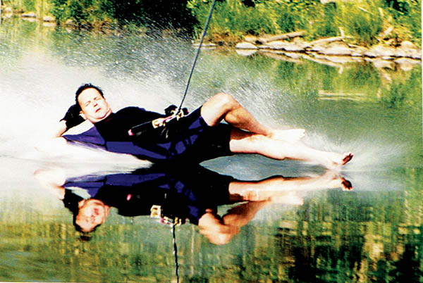 Photo of Alan Shepherd in a reclined position while waterskiing.