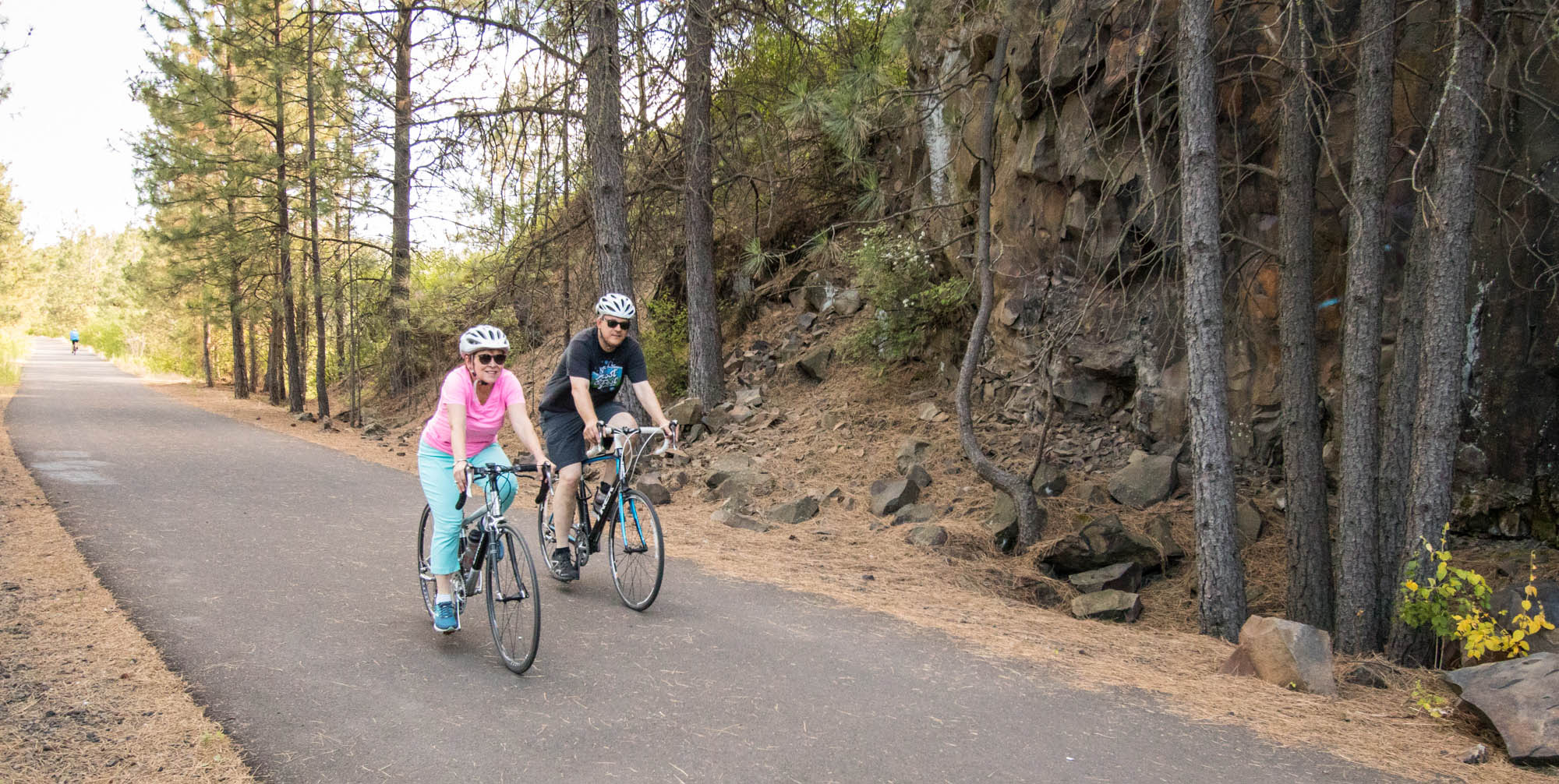 Photo of Lisa Brown and her partner biking on the Fish Lake Trail.
