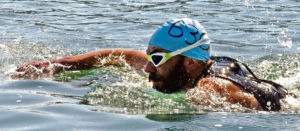 Photo of competitive swimmer during the Long Bridge Swim in Sandpoint Idaho.