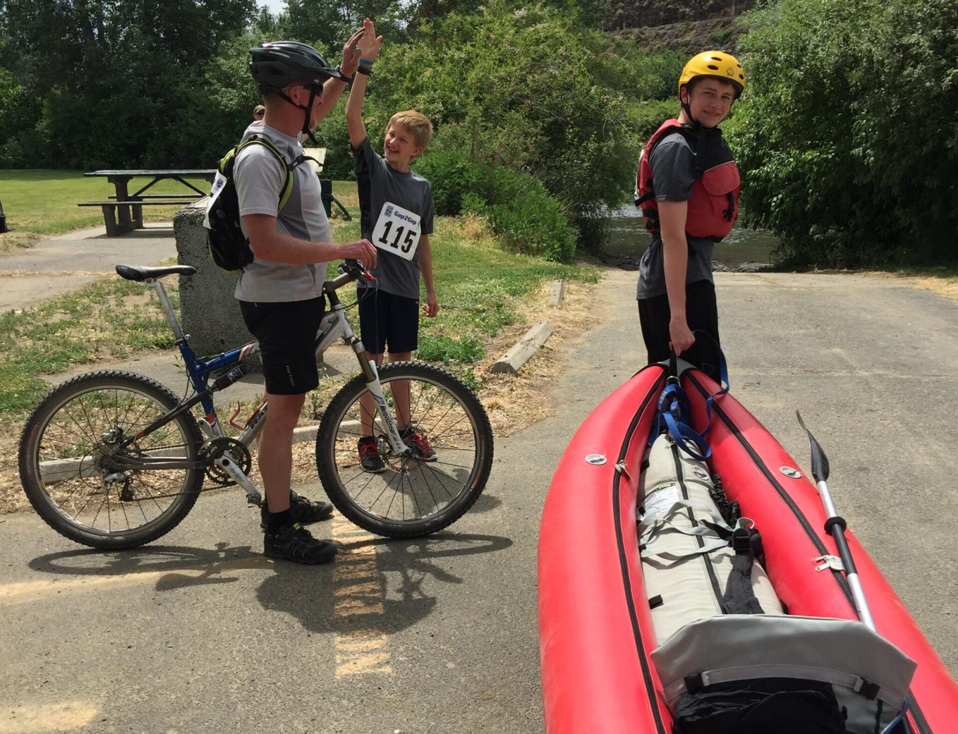 Mountain bikers and kayakers at the transition point.