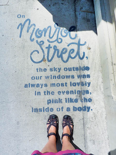 Photo looking down at poetry on the Monroe Street Bridge.