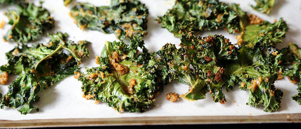 Photo of cheesy kale chips.