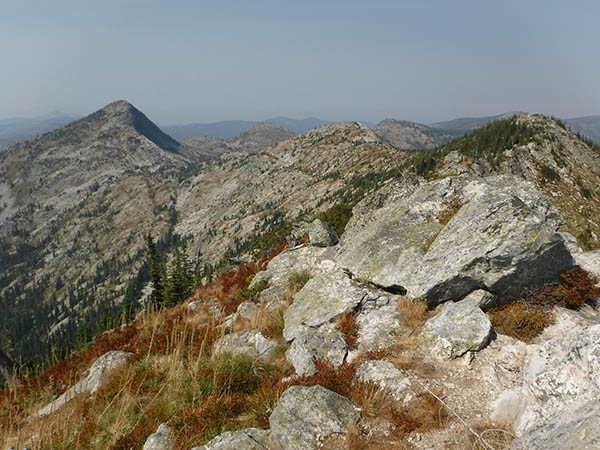 Photo of boulder field with peak in background.