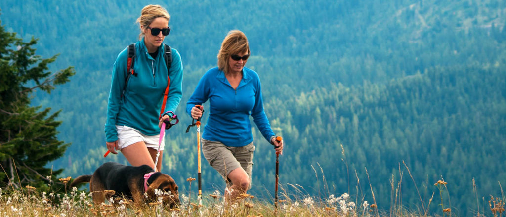 Photo of female hikers and dog on Mount Spokane.