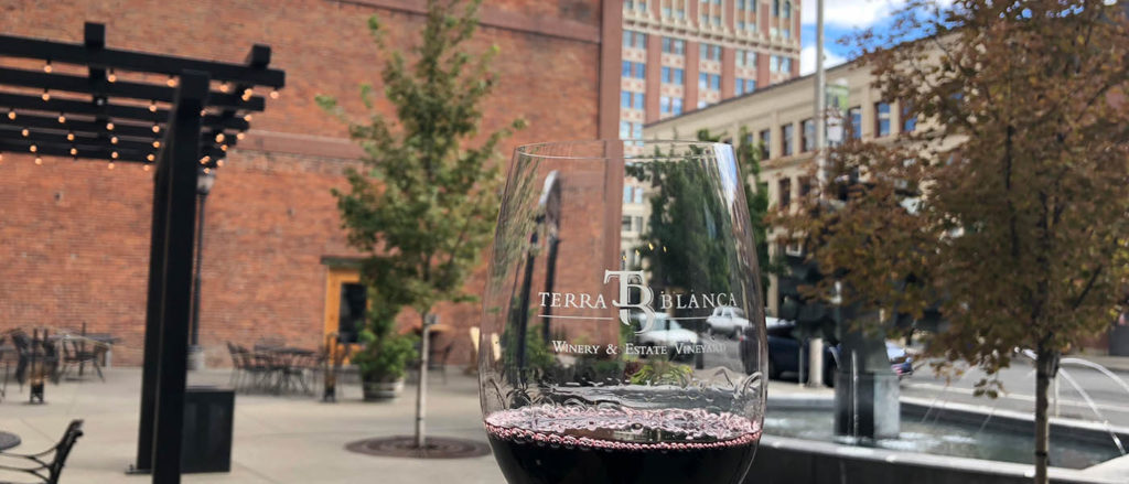A glass of red wine enjoyed outside in downtown Spokane.