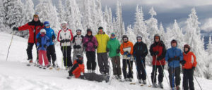 Photo of the entire Fletcher Clan posed on a ski slope at Mt Spokane.