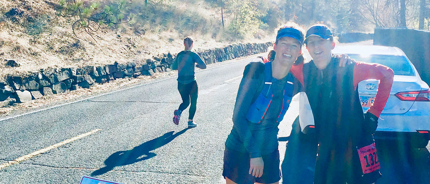 Photo of Summer and Ellen at the 20 mile mark of the Spokane Marathon.