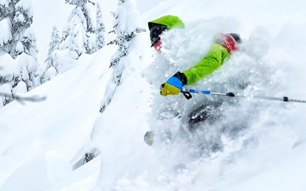 Photo of backcountry skier in powder on Kootenay Pass.