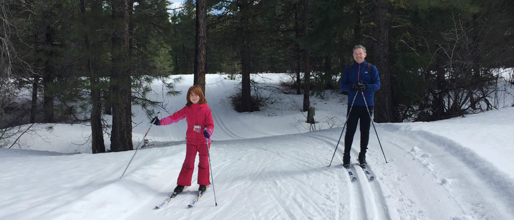 Gordon Ritchie (right) and his daughter cross-country skiing.