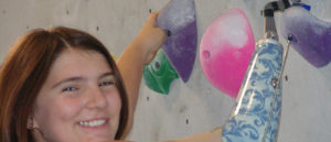 Photo of Helen McGear on the climbing wall.