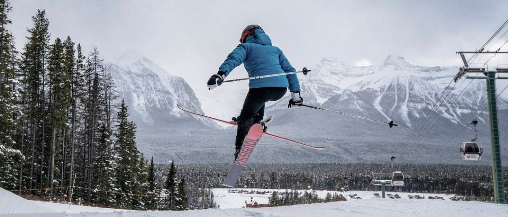 Photo of skier mid air.