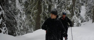 Photo of Trevin Hansen and father cross country skiing.