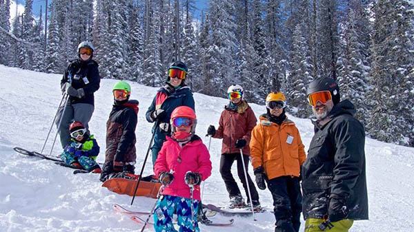 Photo of the Allen family on skis