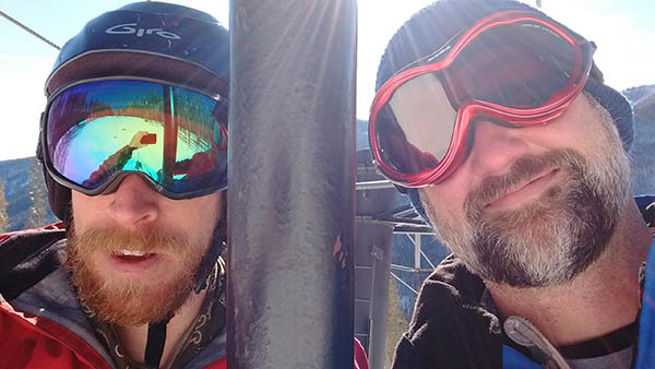 Selfie of Josh Mills and the author on the chairlift.