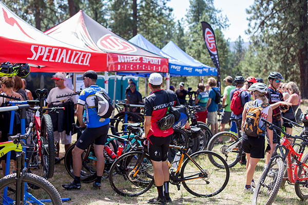 People gathering at bike shop tents at Spokatopia to learn more about bikes and test ride.