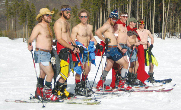 Photo of skiers shirtless wearing cut-offs