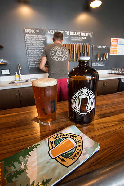 Photo of growler and beer taken at the bar in Bellweather Brewing