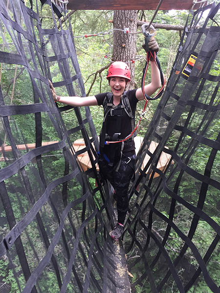 Photo of girl on aerial course.