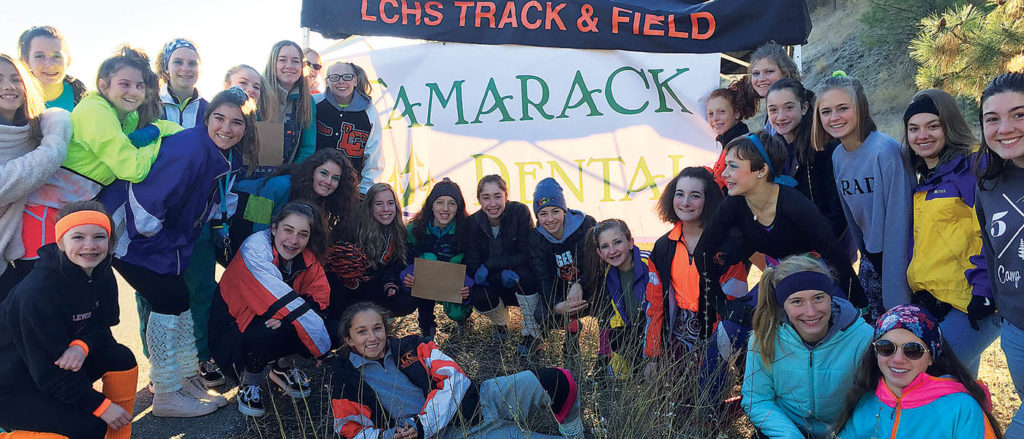 Photo of LCXC volunteers posed in front of aid station.
